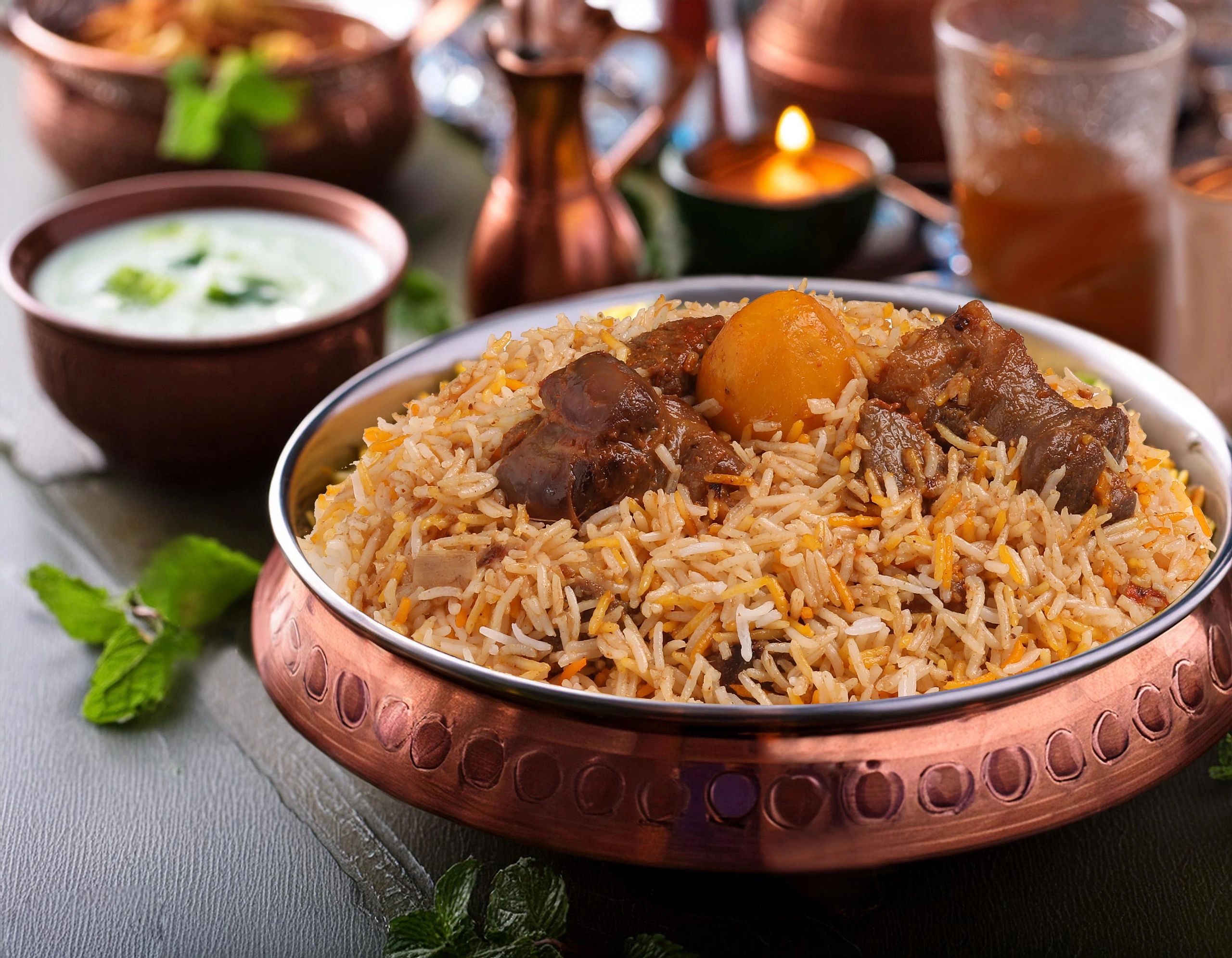 Biryani served in a bowl with raita